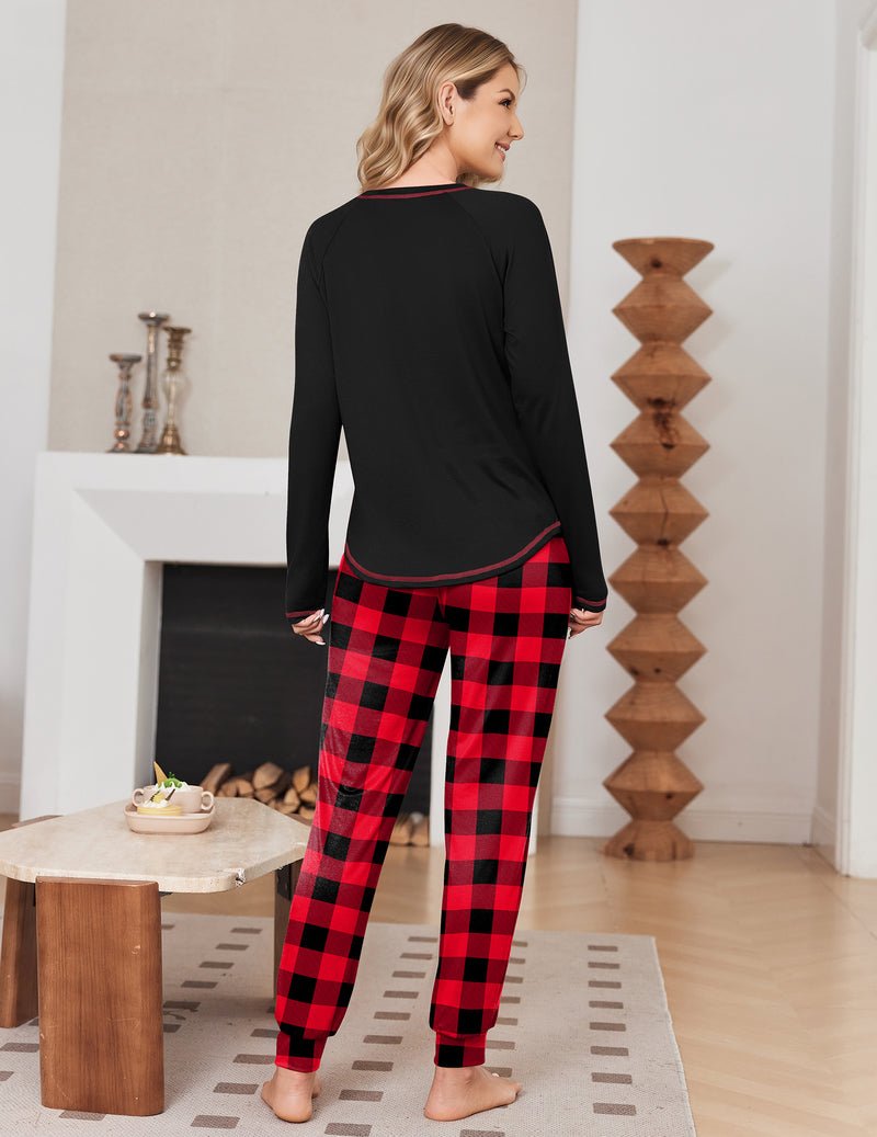 Back view: black long-sleeve pajama top with red plaid jogger pants, contrast trim