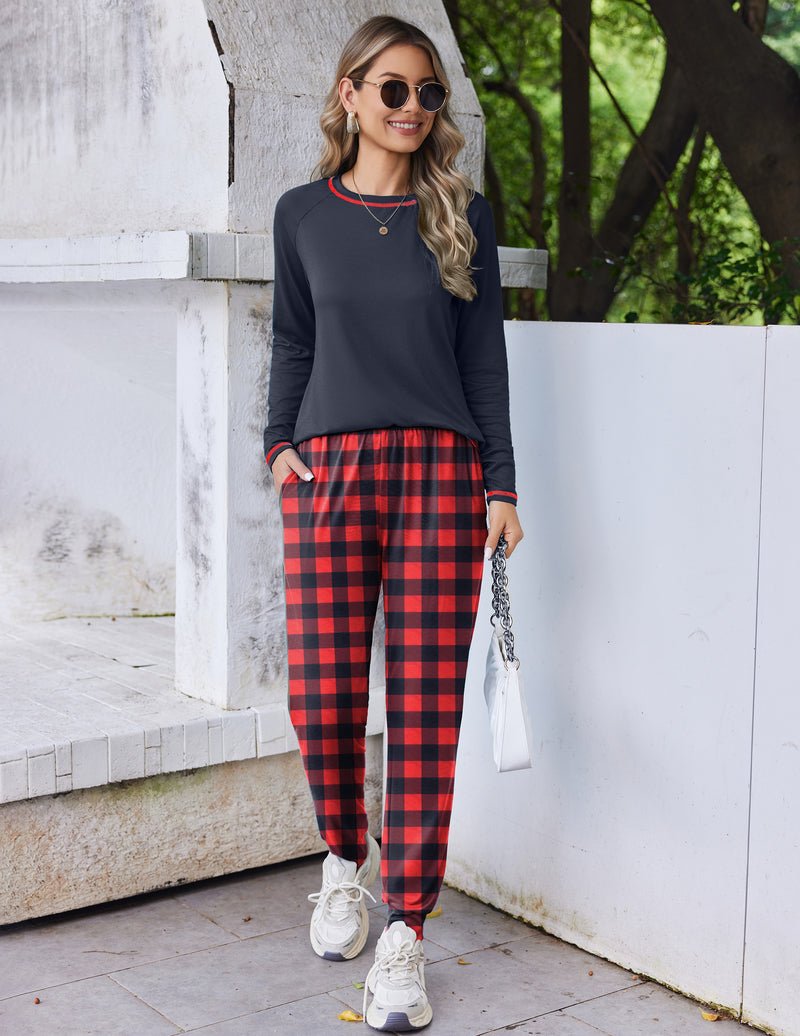 Dark navy long-sleeve pajama top with red-and-black plaid joggers, cuffed ankles