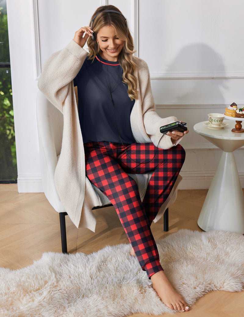 Navy long-sleeve pajama top with red-and-black plaid jogger pants, elastic cuffs