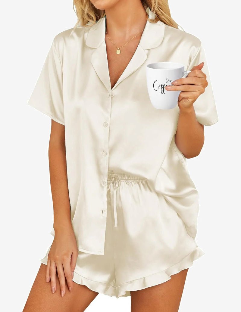 White satin pajama set with short-sleeve button shirt and drawstring shorts