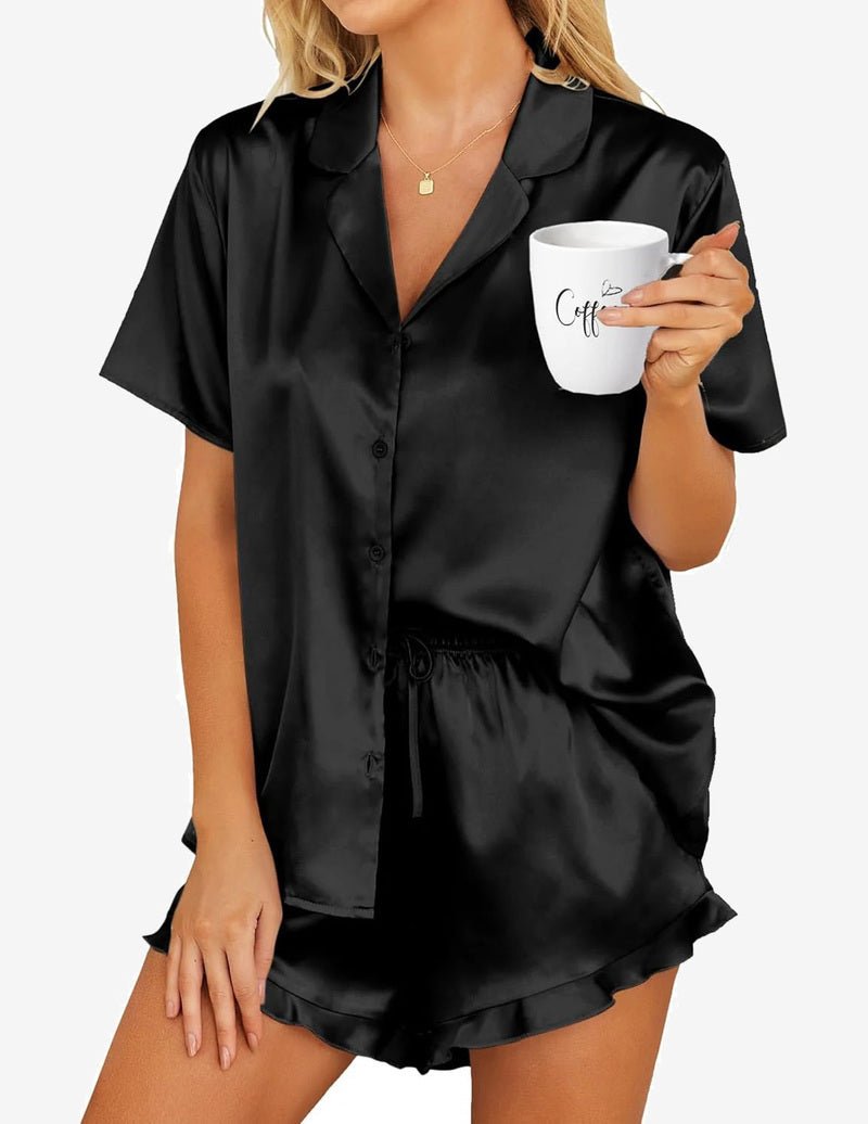 Black satin pajama set with short-sleeve button shirt and drawstring shorts