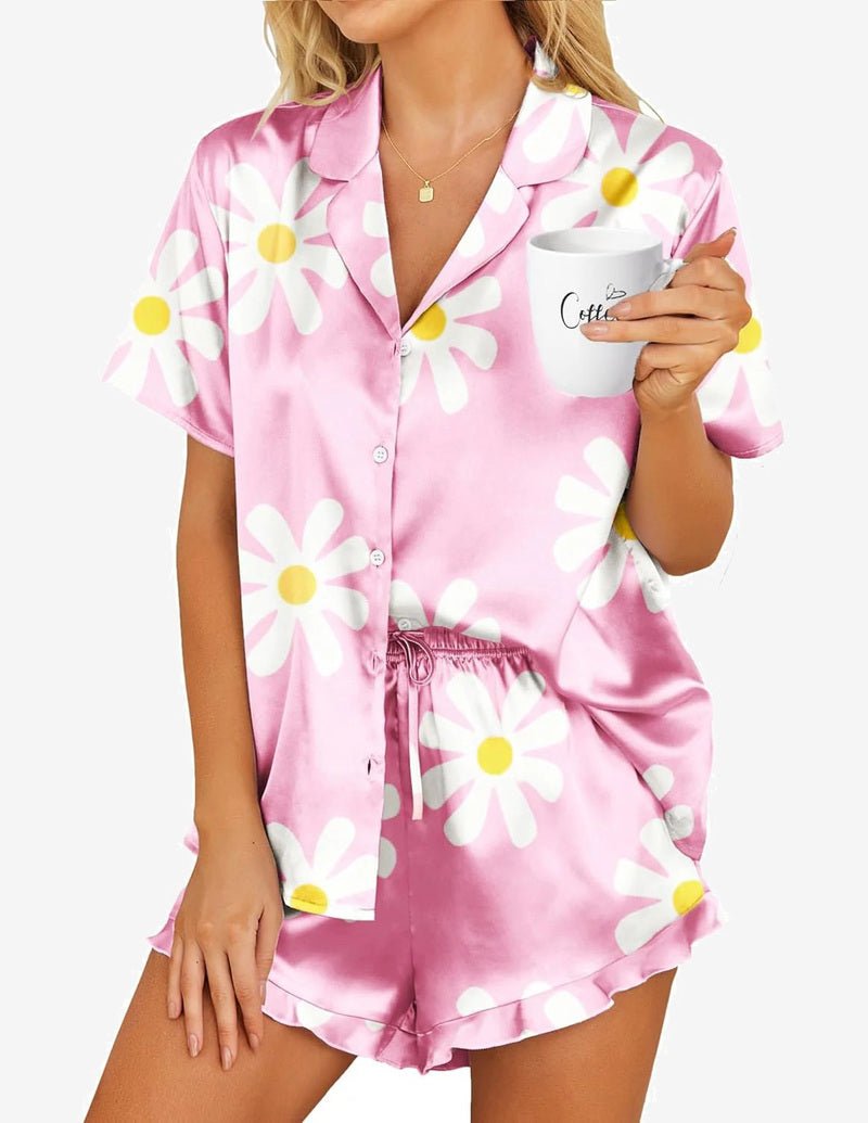 Satin pajama set in pink daisy print, short-sleeve button-up and matching drawstring shorts