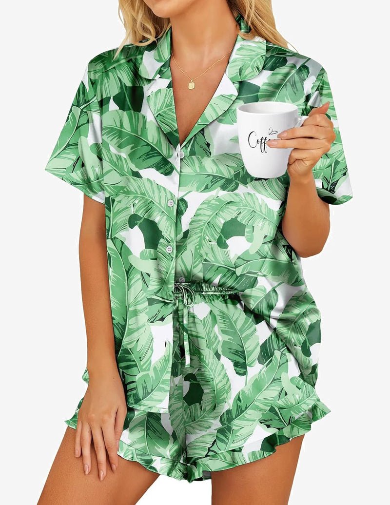 Satin pajama set in green leaf print, short-sleeve button-up with tied waist shorts