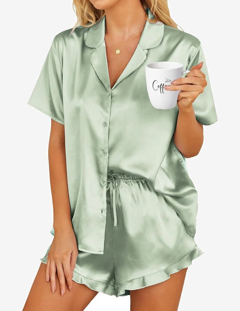 Light green satin pajama set with short-sleeve button shirt and drawstring shorts