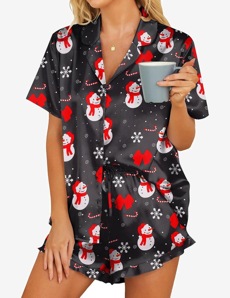 Satin pajama set in black with red snowman print, short-sleeve button-up and drawstring shorts