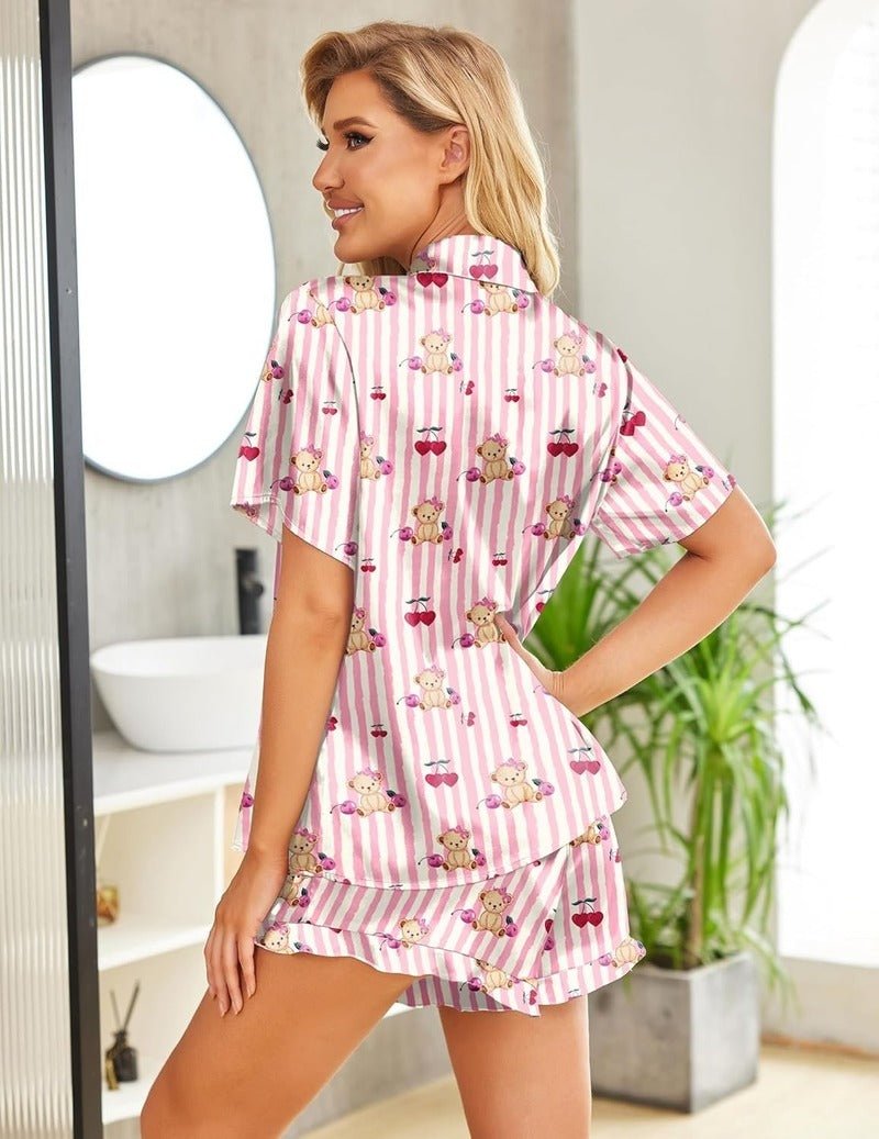 Pink-and-white striped satin pajama set with ruffled hem and button shirt