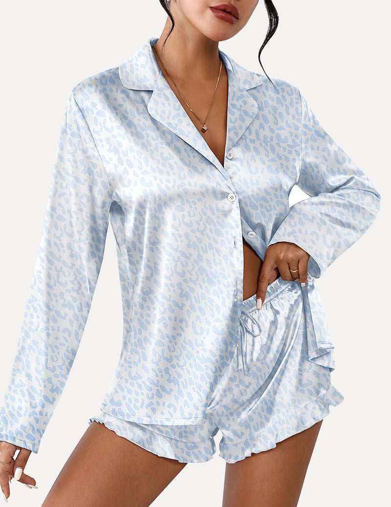 Light blue patterned satin pajama set with button-front long sleeves and ruffled shorts