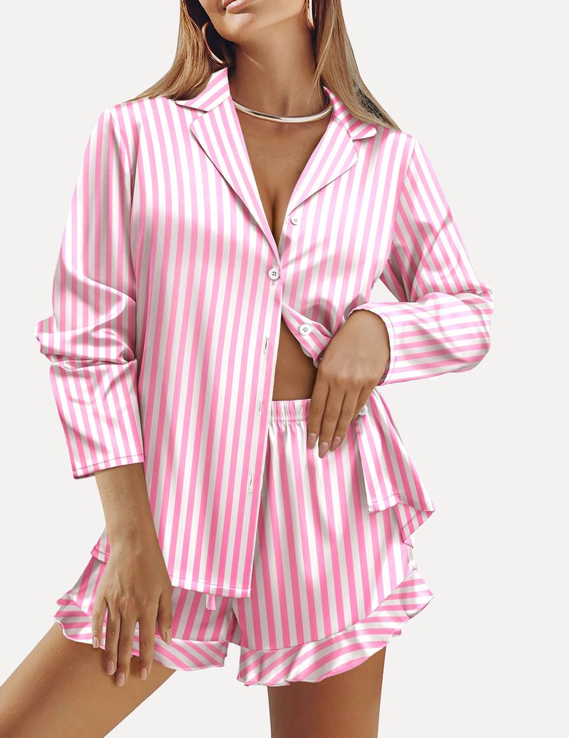 Satin pajama set with button-front long sleeves and ruffled pink-and-white striped shorts.