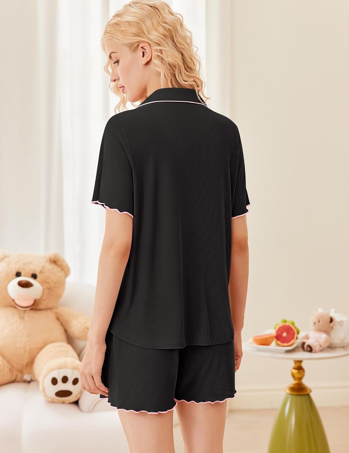 Back view of black short-sleeve pajama top and matching shorts set