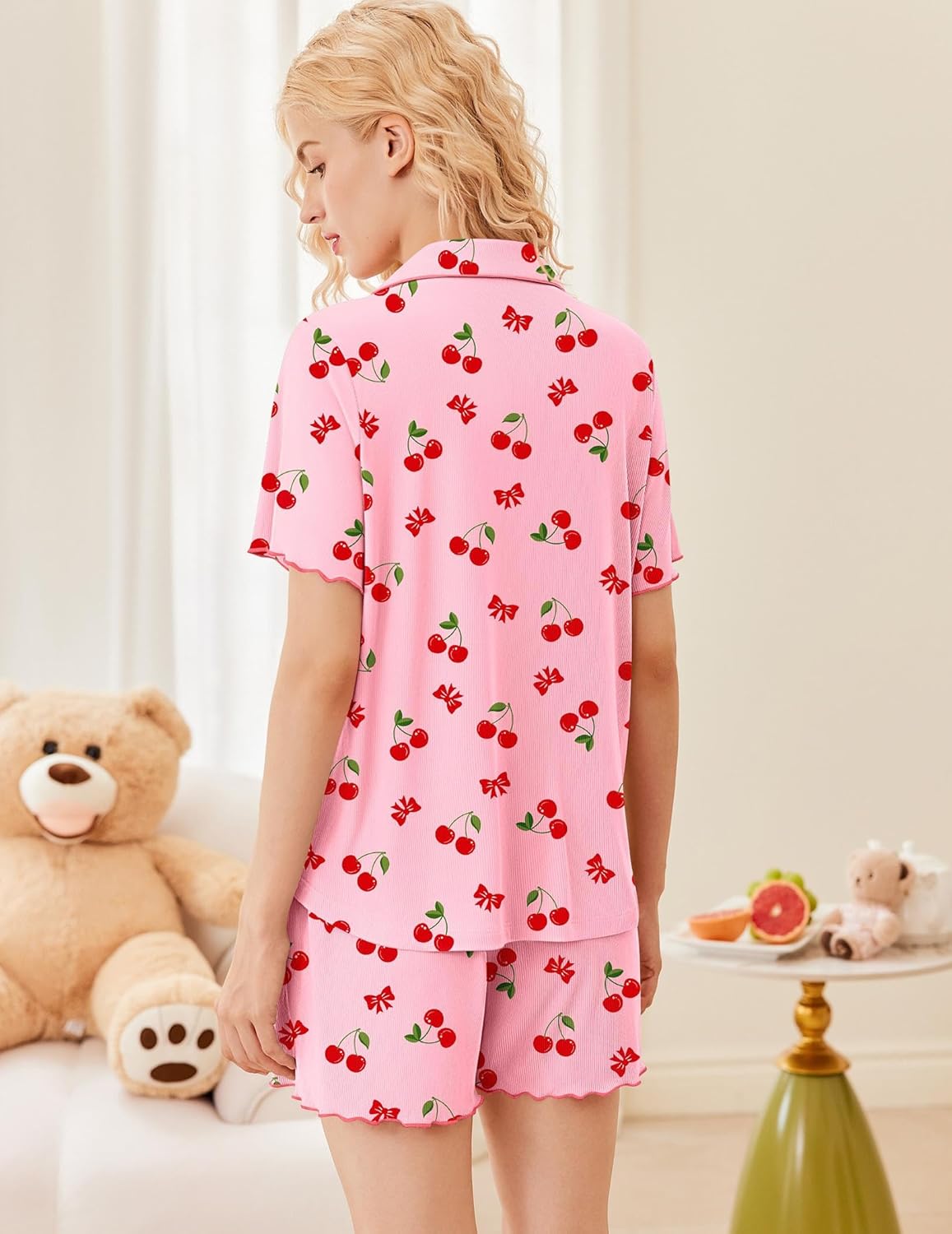 Pink ribbed pajama set with cherry print, back view, button-up top and matching shorts