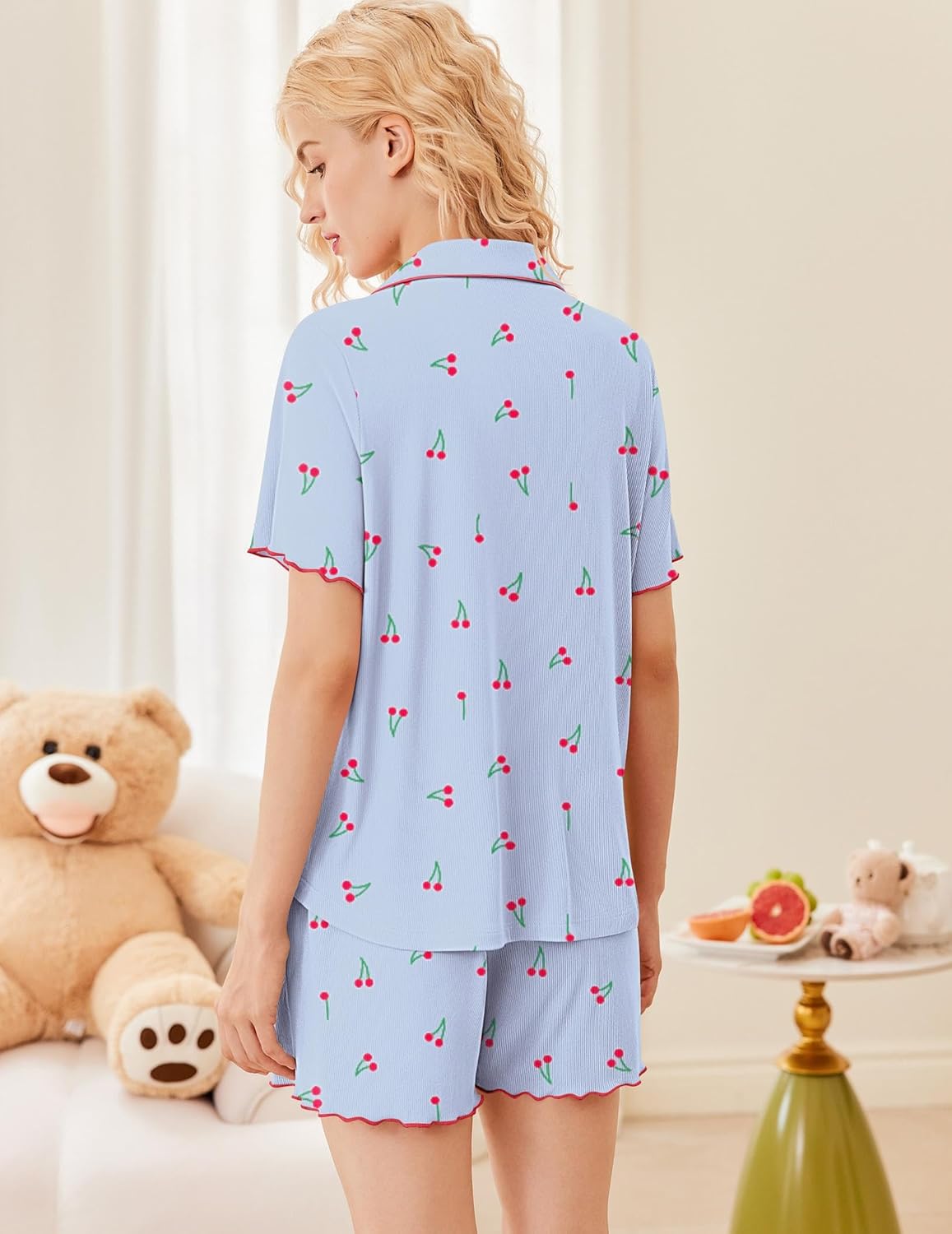 Blue ribbed pajama set, back view with scattered cherry print and button-up top, shorts
