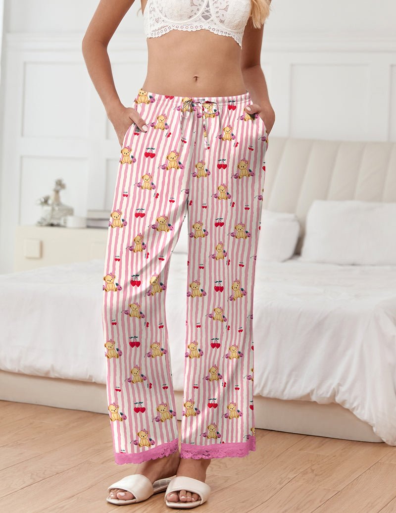 Pink striped pajama pants with teddy bear print and red bow details, lace-trim cuffs