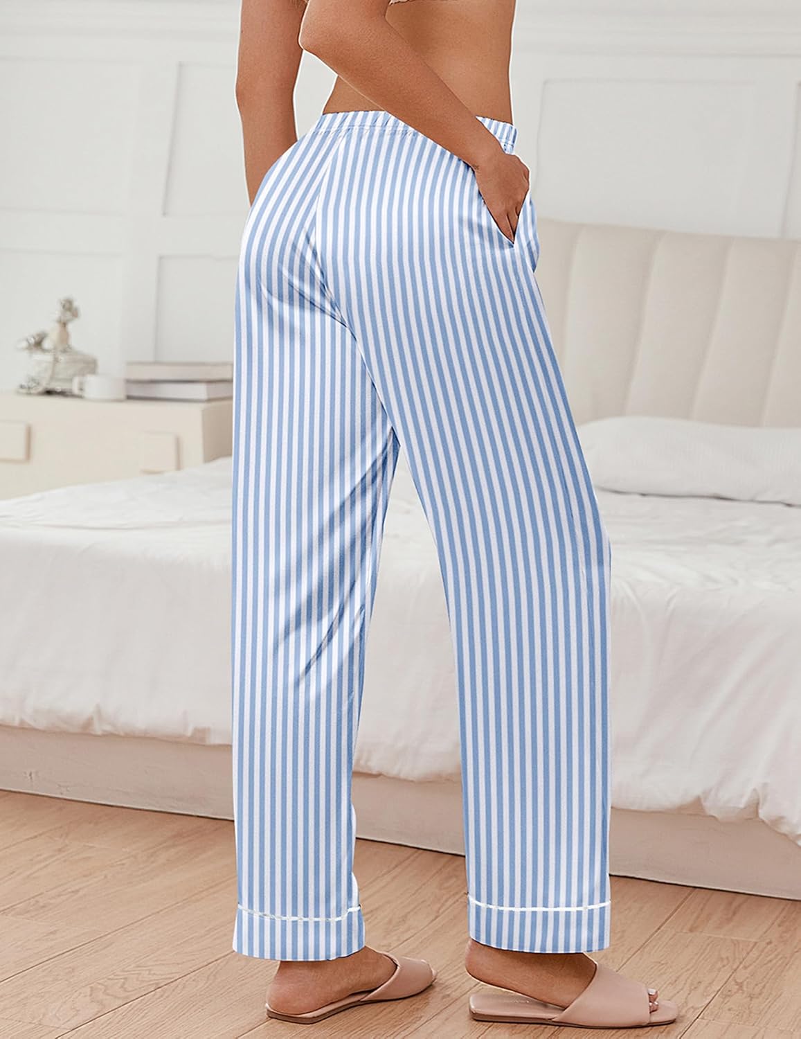 Light blue striped satin pajama pants with elastic waistband and contrast trim at cuffs.