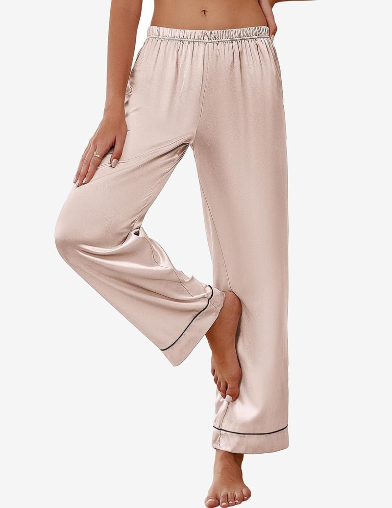 Light pink satin pajama pants with elastic waistband and dark piping at cuffs.