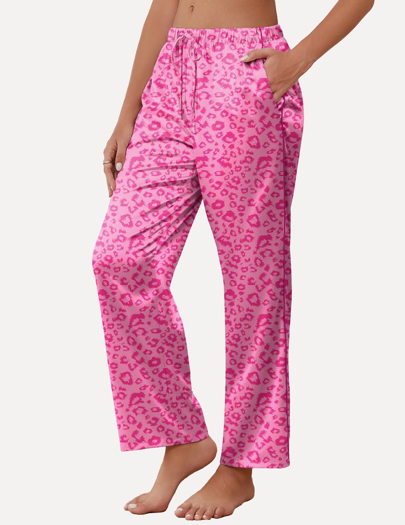 Pink patterned satin lounge pants with drawstring waist and wide cropped legs