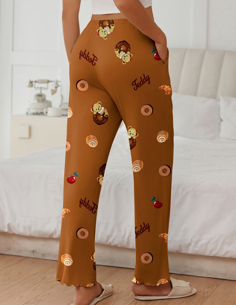 Brown teddy lounge pants with colorful character and circle motifs, relaxed wide legs