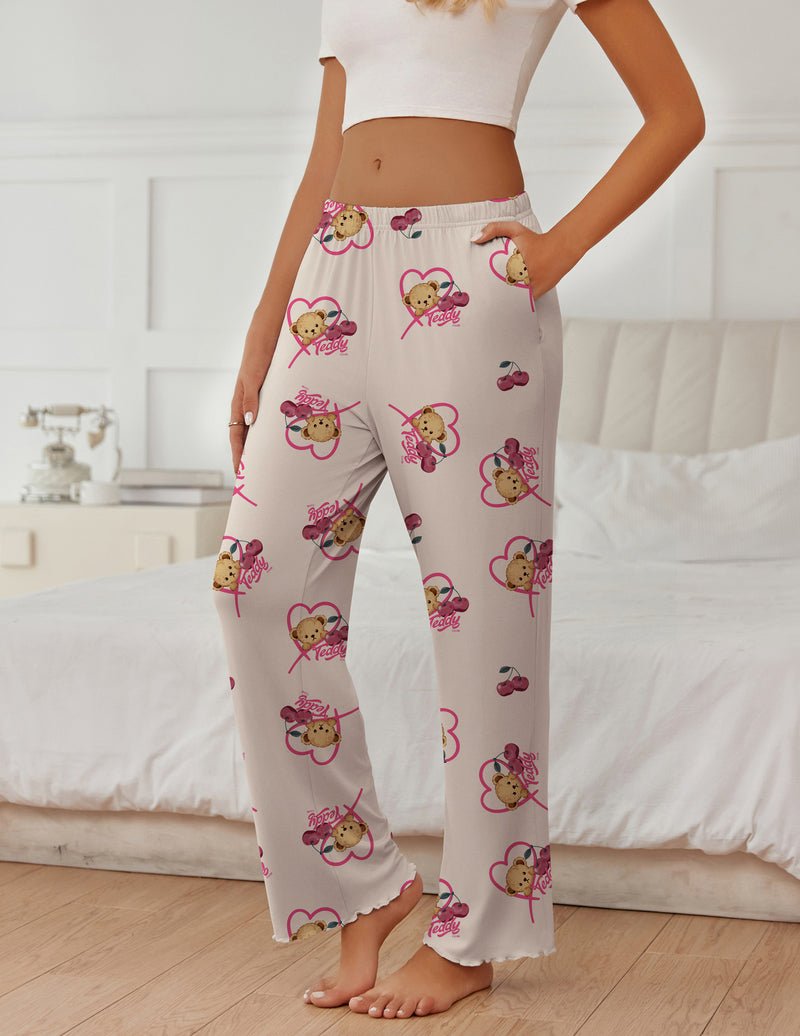 White pajama pants with pink teddy and heart motifs, wide leg and elastic waist