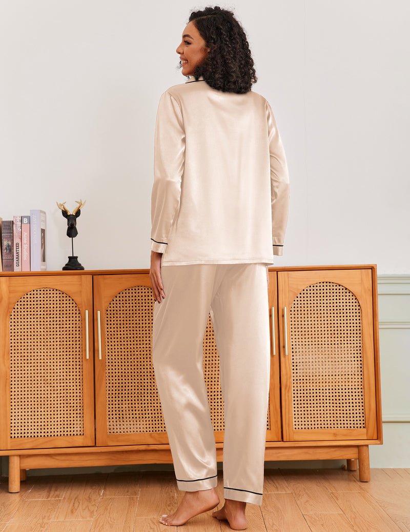 Cream satin pajama set with black trim, long sleeves and matching long pants