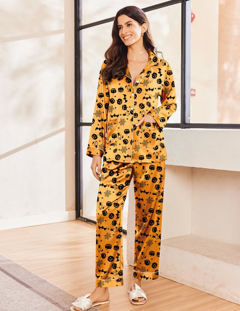 Two-piece satin pajama set with Halloween icons print; long sleeve top and pants