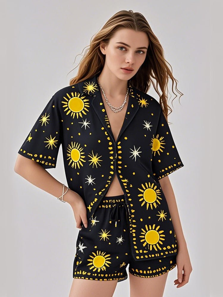 Black sun and star print pajama set with short-sleeve button shirt and matching shorts