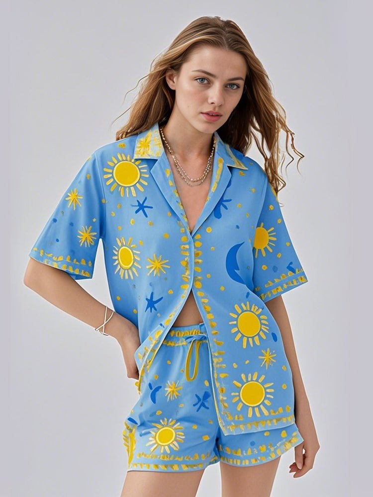 Blue sun and star print pajama set with short-sleeve button shirt and matching shorts