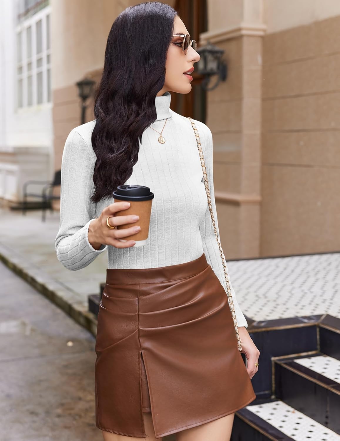 White ribbed turtleneck long-sleeve top, side view with skirt
