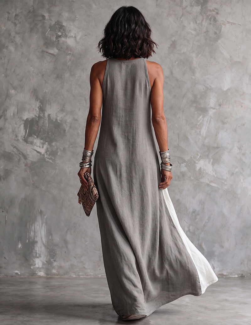 Grey asymmetric sleeveless maxi dress back view with side slit and white color-block panel