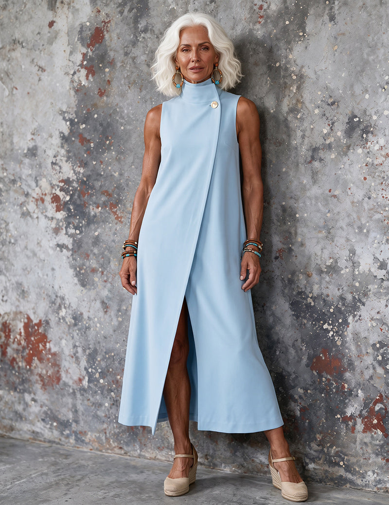 Light blue sleeveless maxi dress, mock neck with gold buttons and long A-line hem