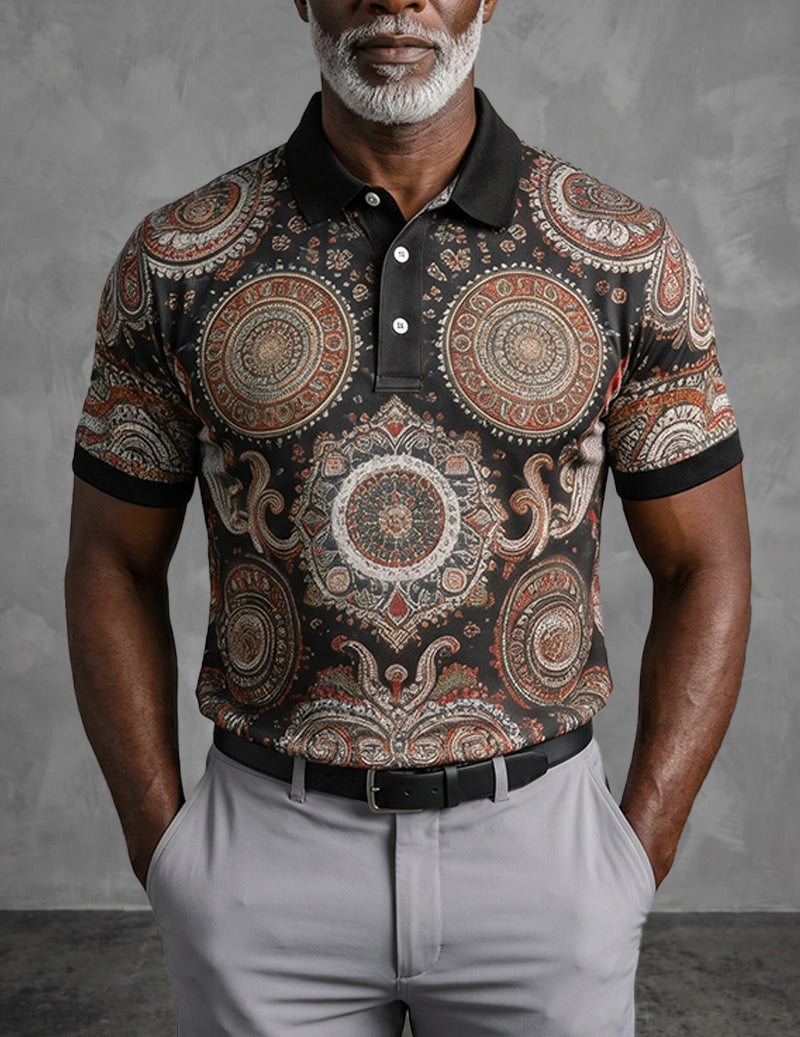 Black polo shirt with large mandala paisley print, collared short sleeves, button placket