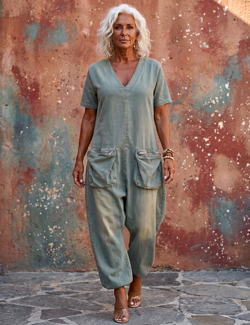Light blue denim V-neck short-sleeve cargo jumpsuit with roomy wide-leg fit and flap pockets