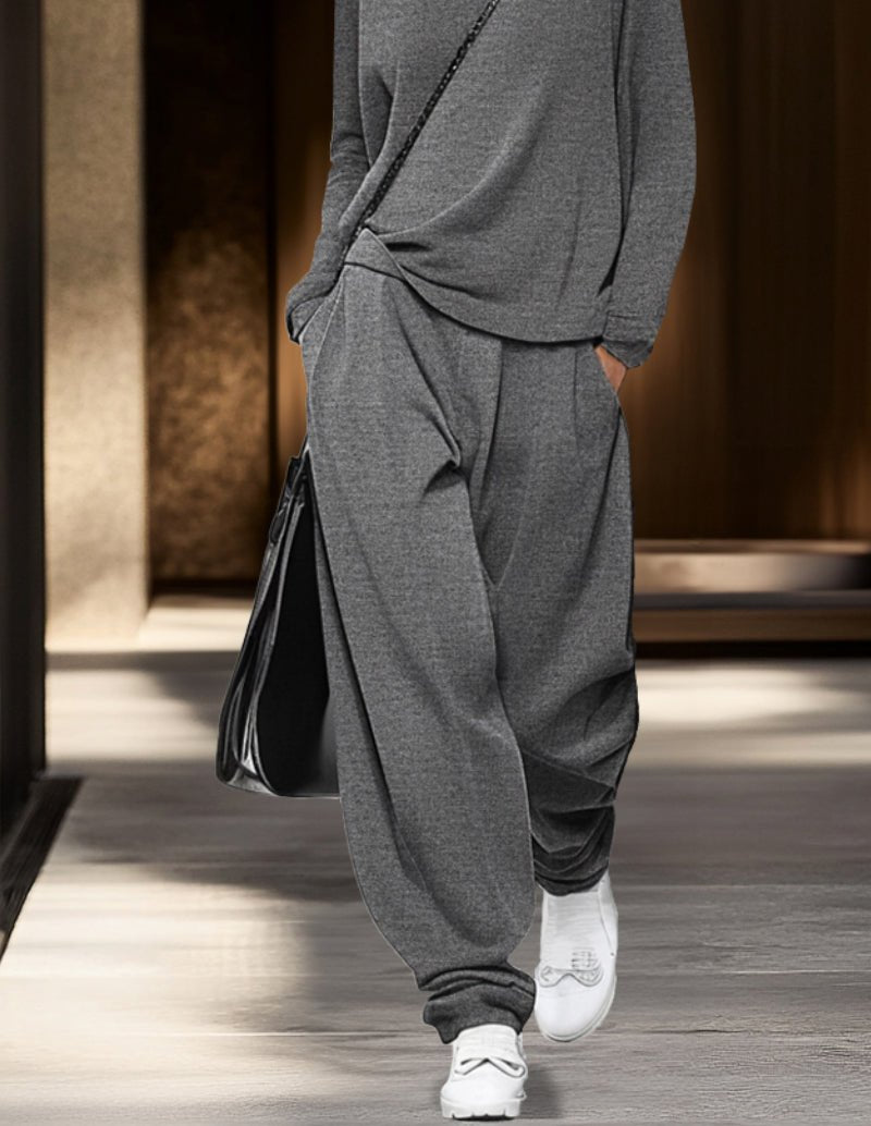 Grey turtleneck lounge set with long sleeves and relaxed jogger pants, cuffed hem.