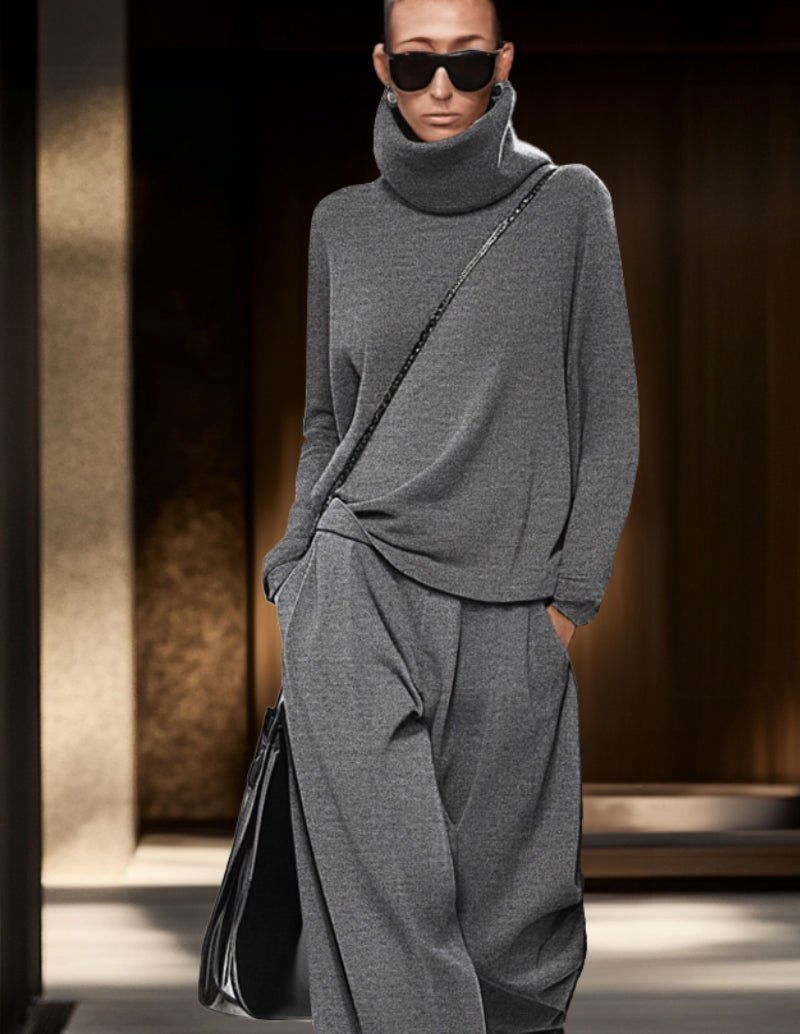 Grey 2-piece lounge set with draped turtleneck top and matching jogger pants.