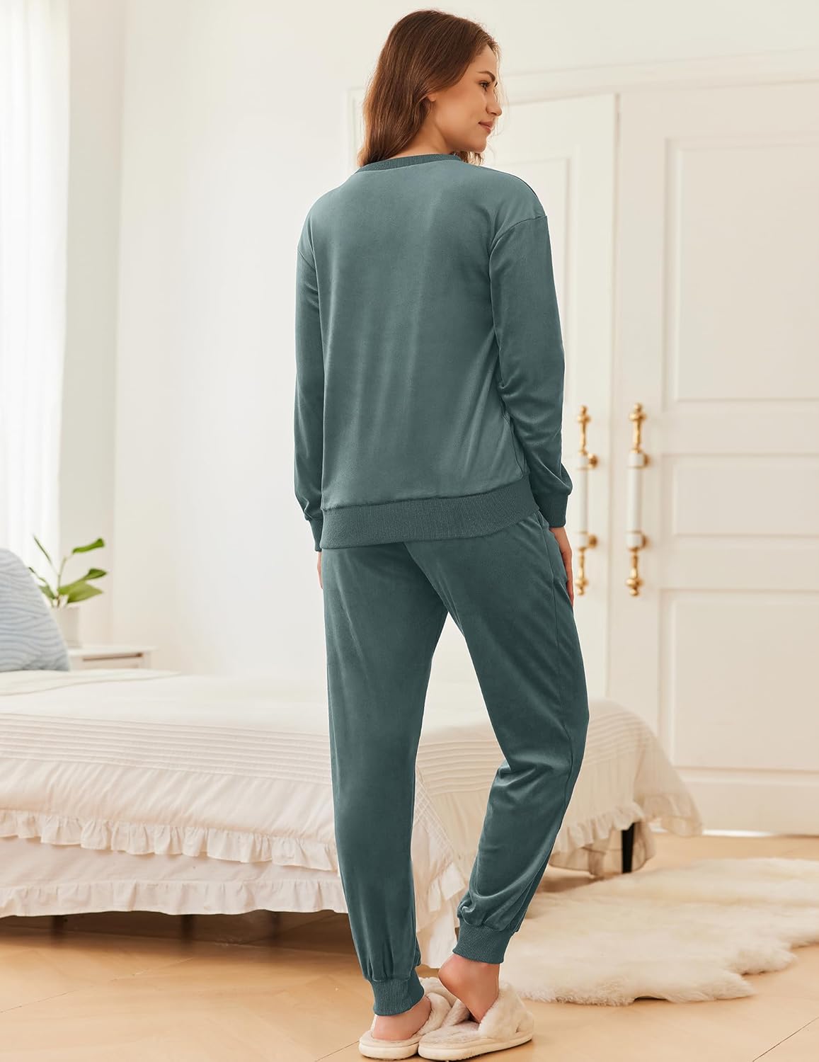Dark green velvet long-sleeve pajama set from back view with cuffed jogger pants