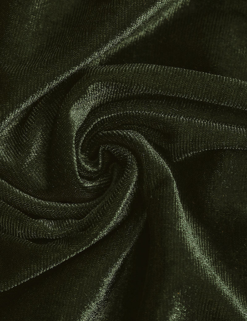 Dark green velvet fabric close-up with soft sheen and swirling texture