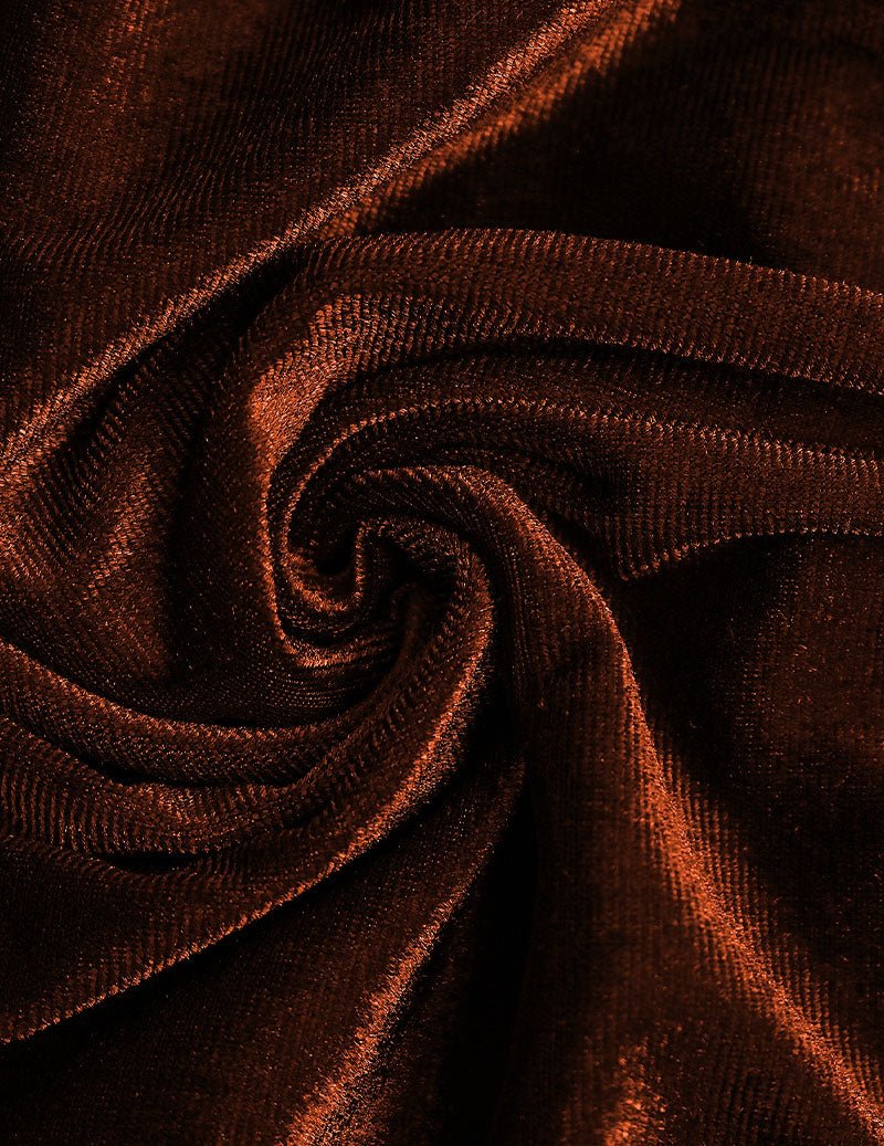Brown velvet fabric close-up with soft sheen and swirling texture