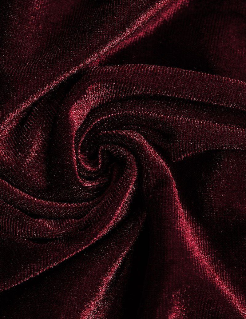 Wine red velvet fabric close-up with soft sheen and swirling texture