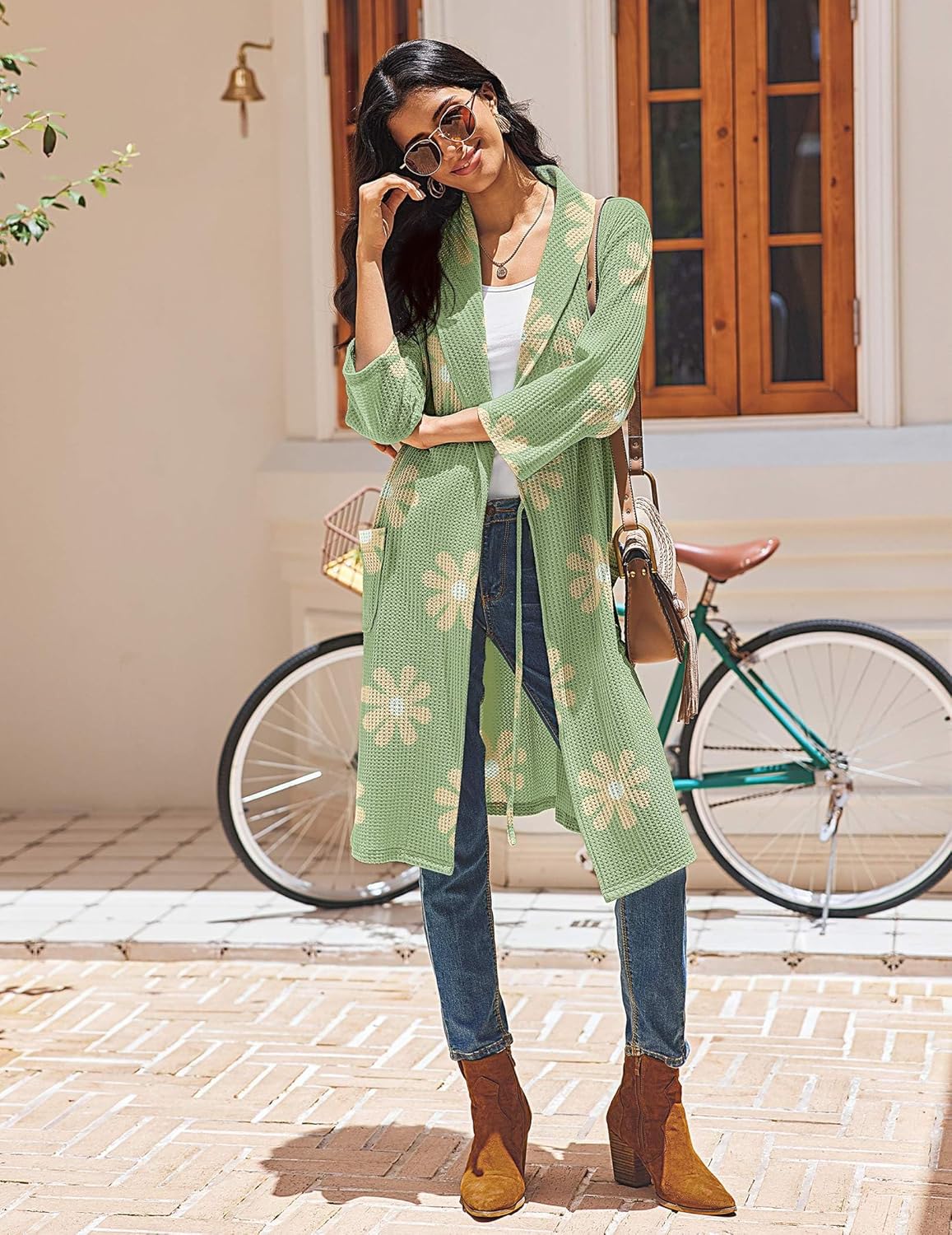 Green waffle knit kimono robe with daisy print, tie waist, side pockets, 3/4 sleeves.