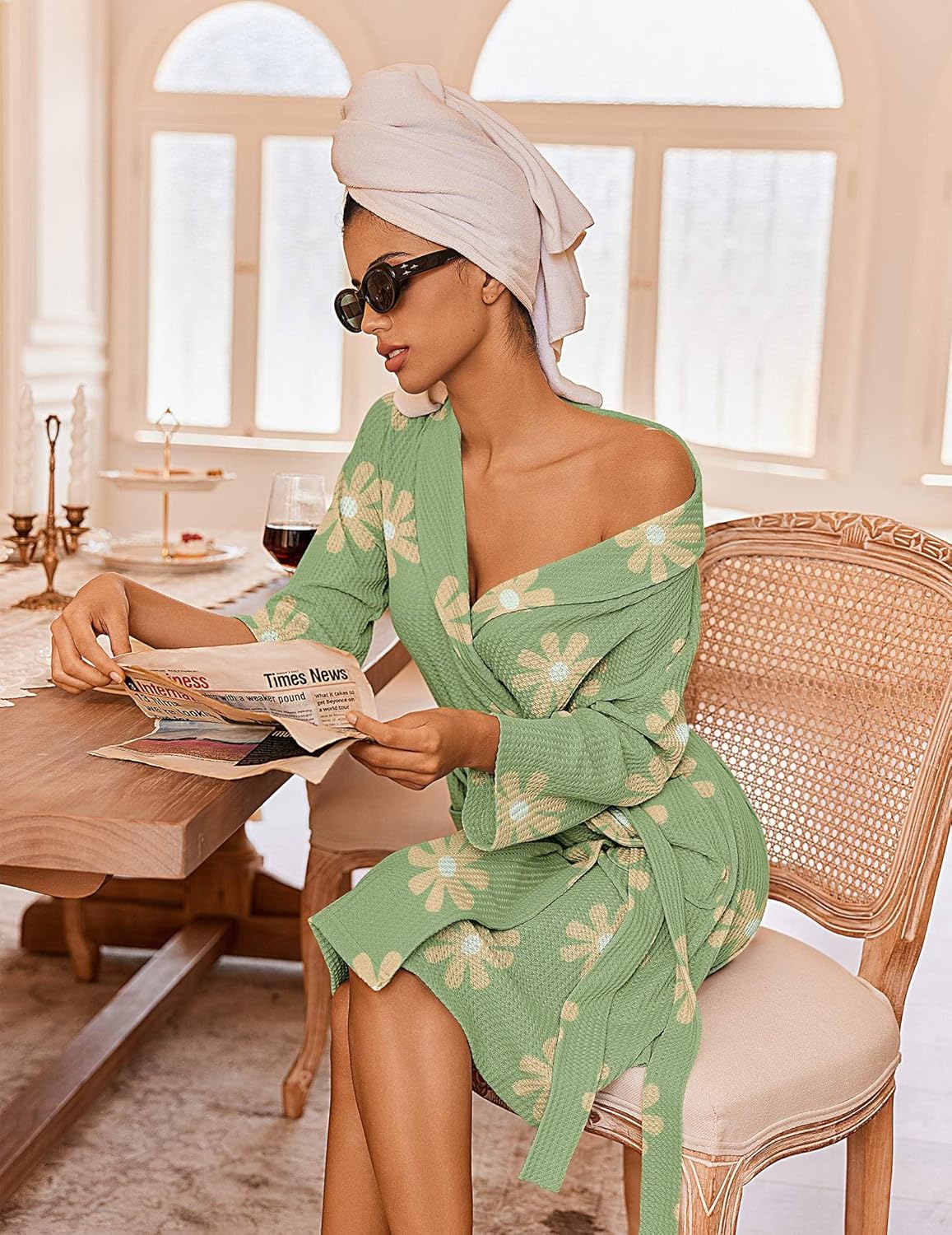 Green waffle knit bathrobe with daisy print, kimono collar, tie waist, side pockets.