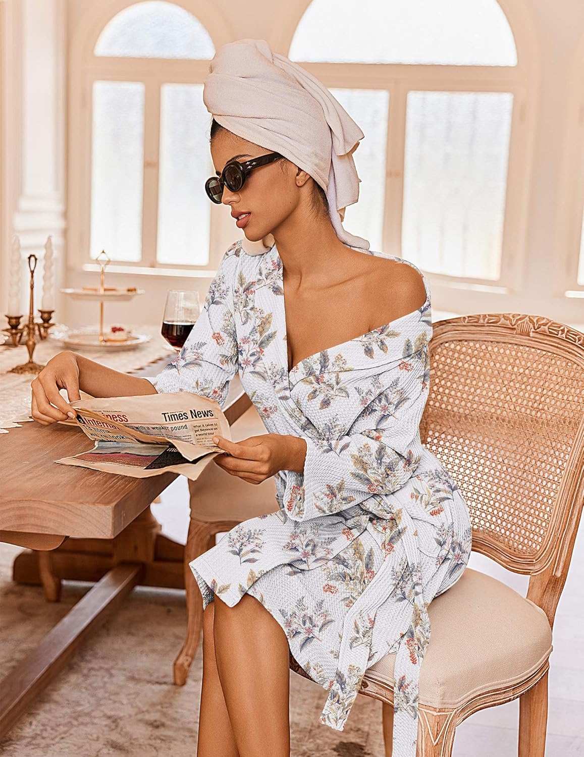 Waffle knit bathrobe with white floral print, kimono collar, tie belt and side pockets.
