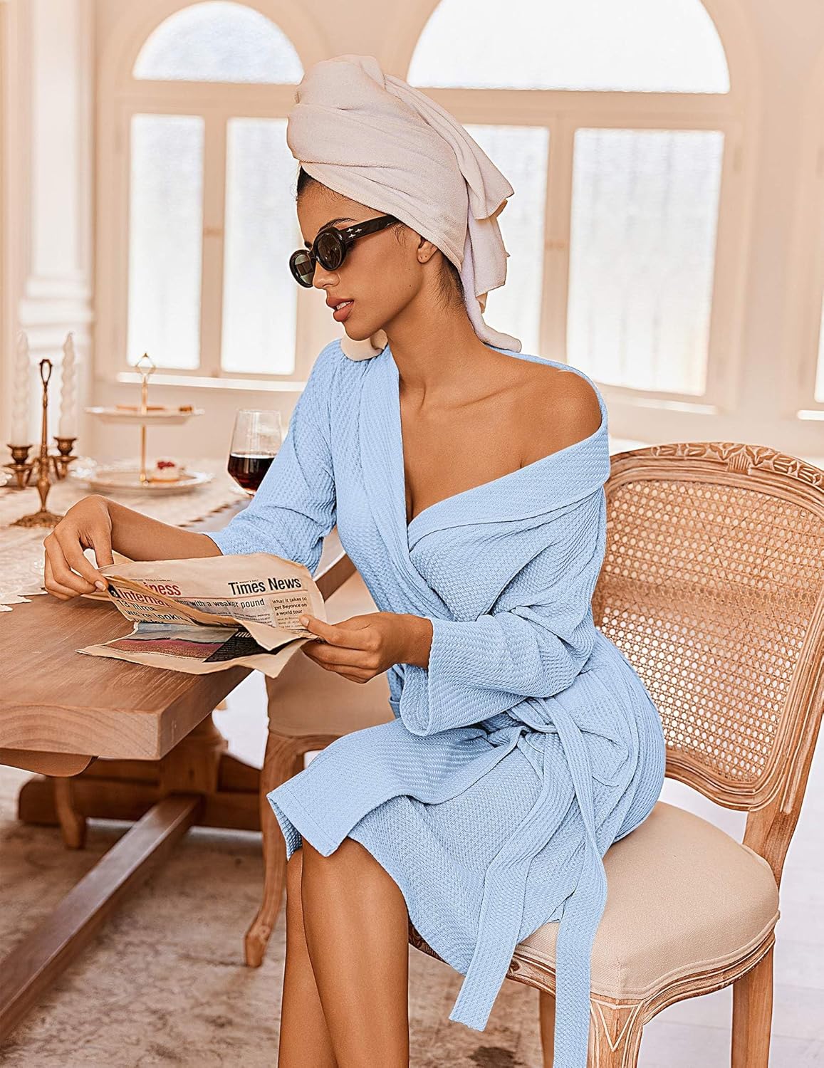 Light blue waffle knit bathrobe with tie waist, kimono collar, side pockets, robe belt.