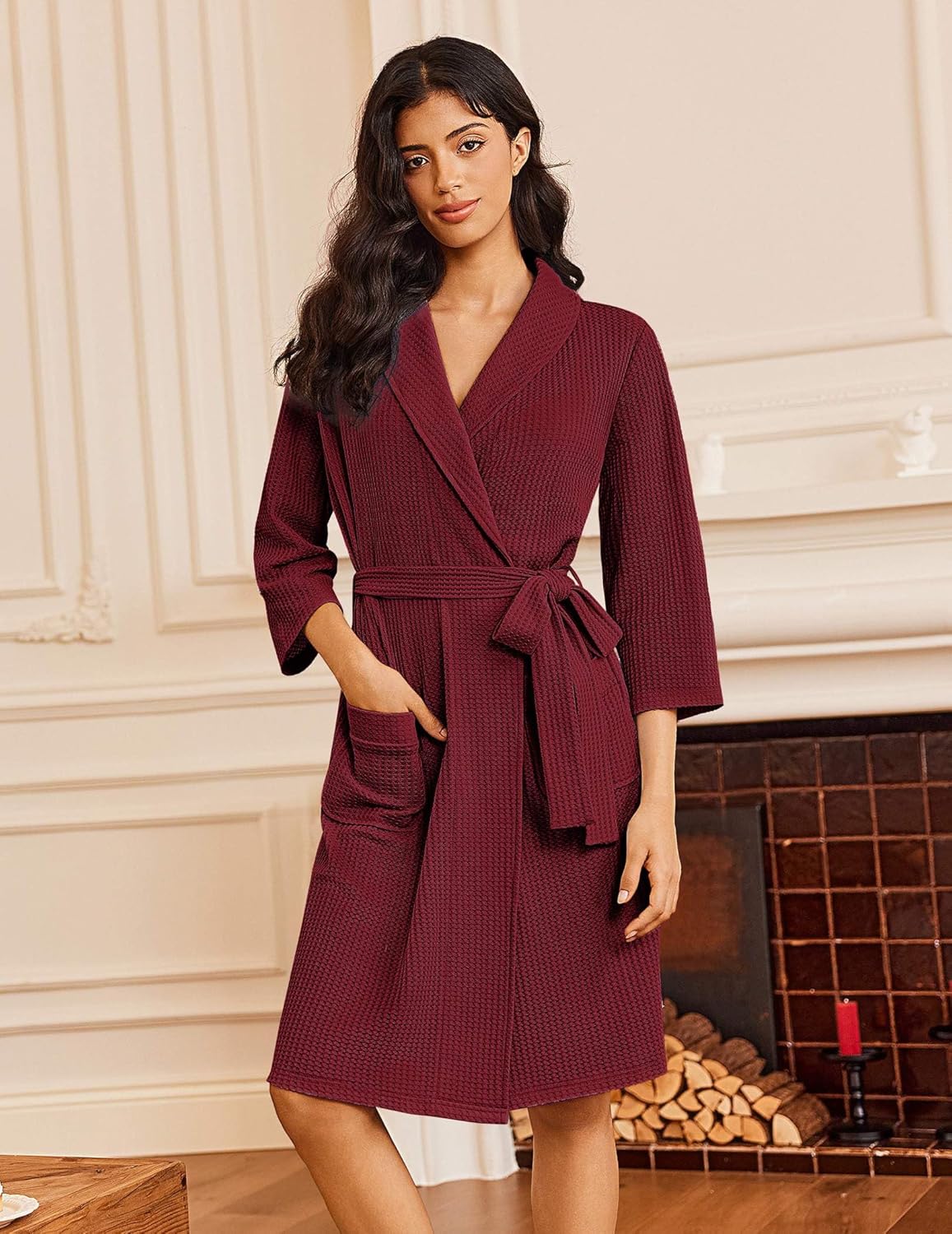 Burgundy waffle knit bathrobe with kimono V-neck, tie belt, side pockets, 3/4 sleeves.