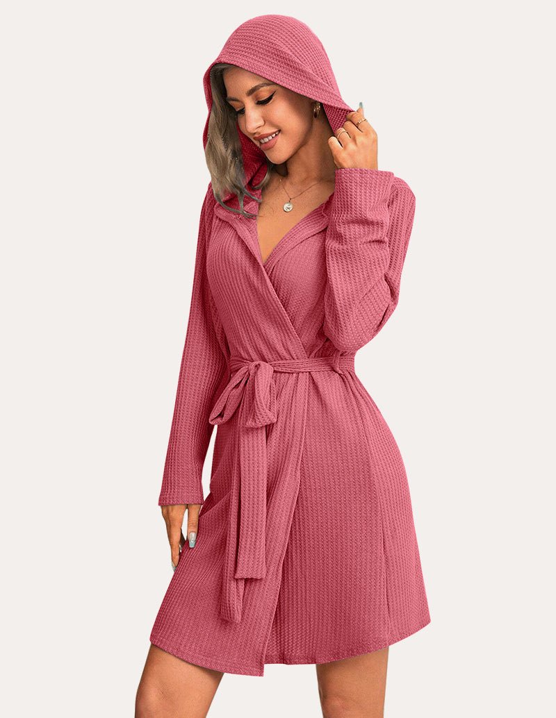 Pink waffle knit hooded bathrobe with wrap front, tie belt, and long sleeves