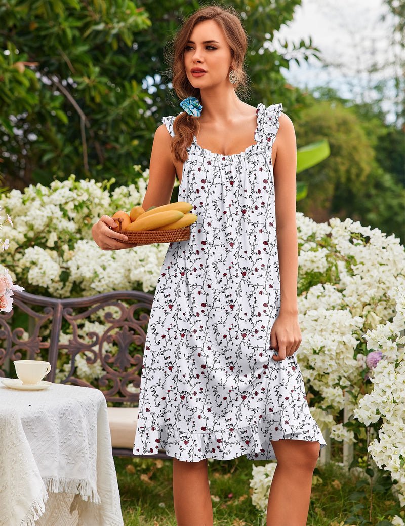 Women’s sleeveless ruffle house dress, white with small red floral vines, tiered skirt