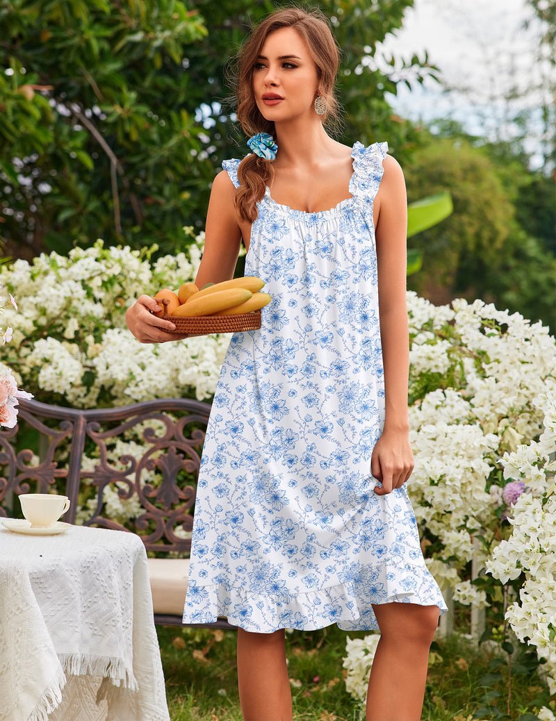 Women’s sleeveless ruffle house dress, white with blue floral sprig print, tiered hem