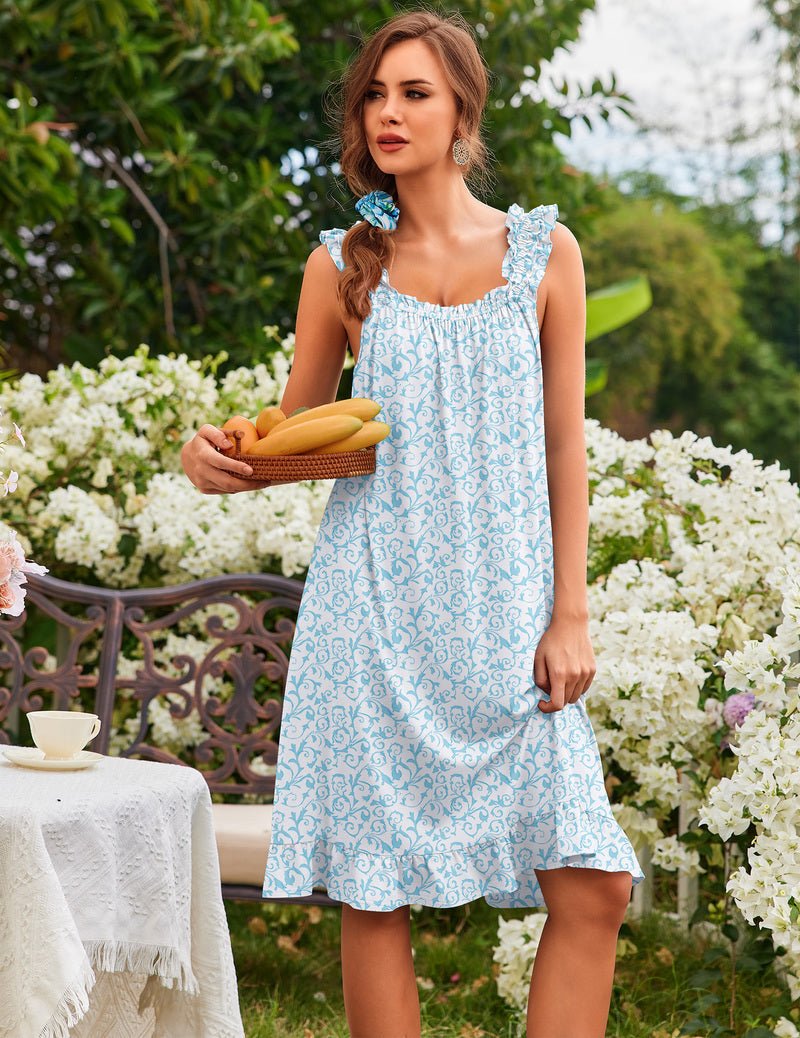 Women’s sleeveless ruffle house dress, light blue ornate floral print, tiered skirt