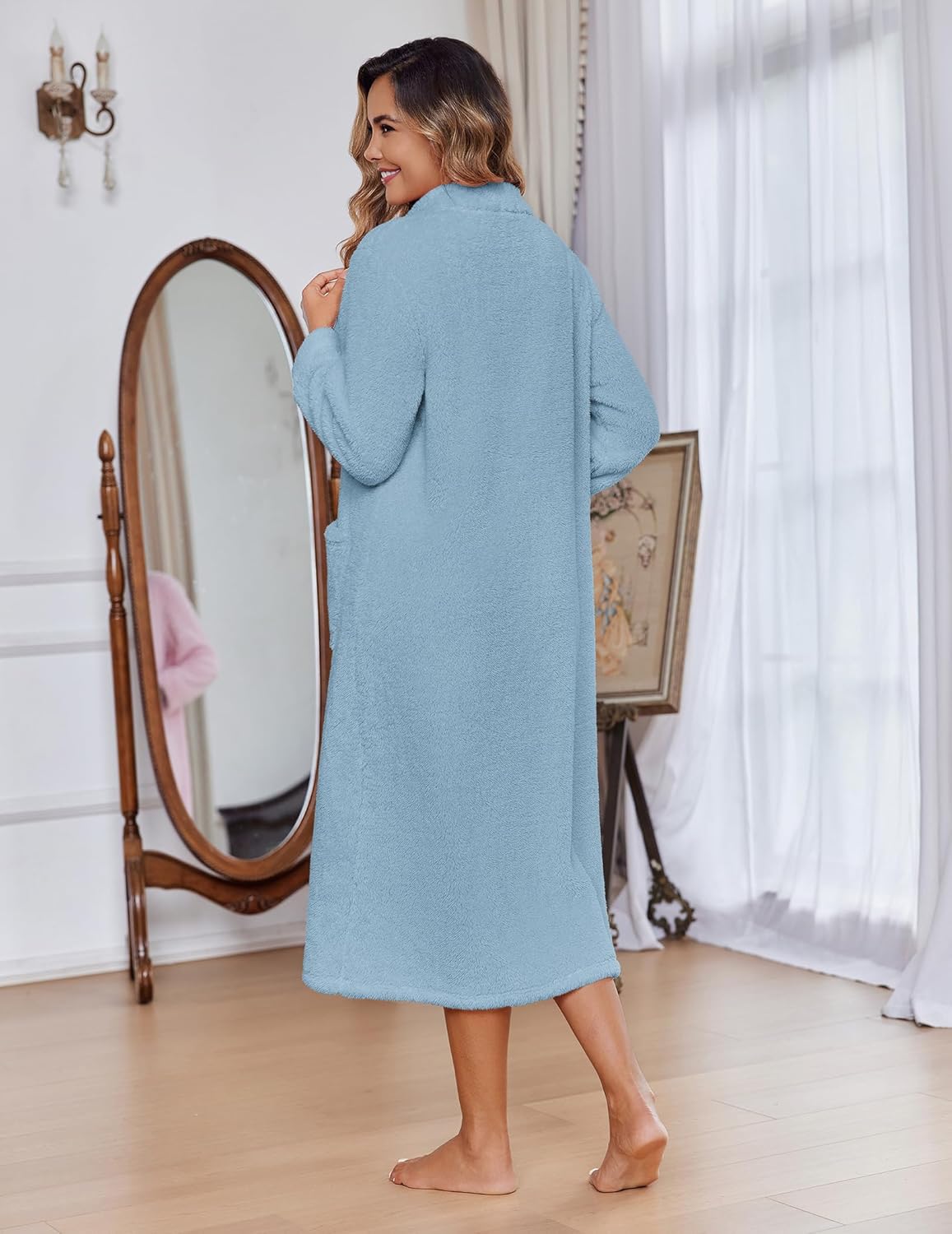 Back view of light blue fleece bathrobe with full-length sleeves and long hem slit