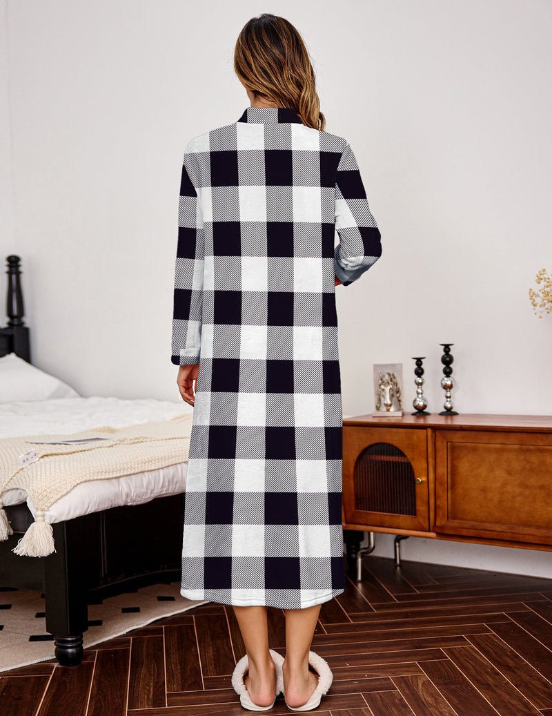 Back view of black-and-white plaid fleece bathrobe with full-length sleeves and hem vent