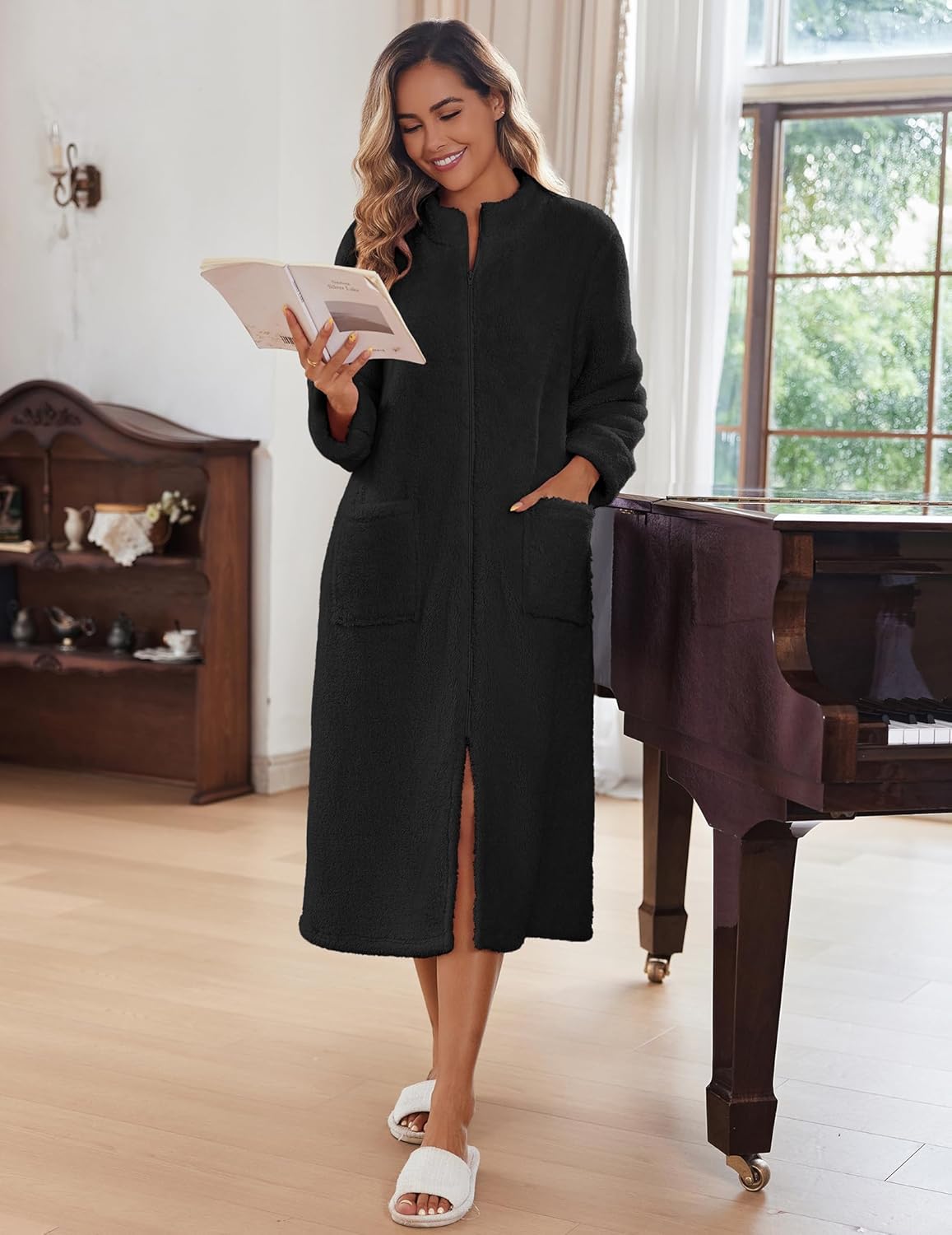 Black fleece zip-up bathrobe with long sleeves and front patch pockets