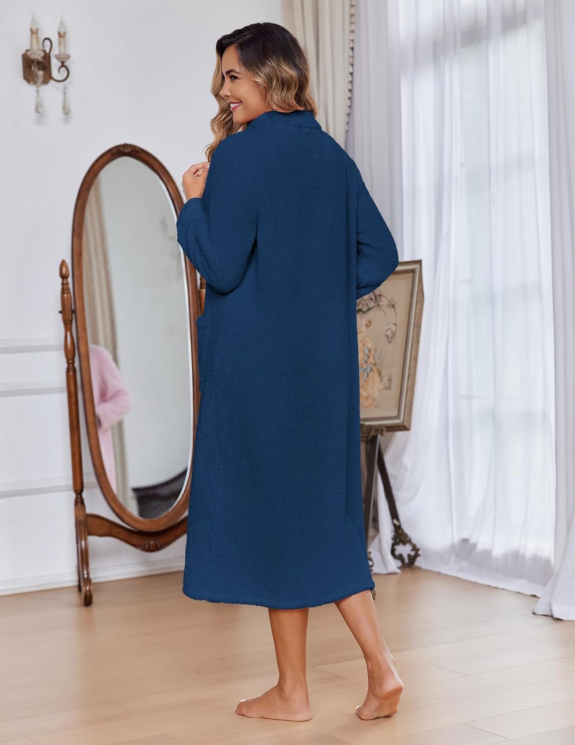 Navy long fleece zip bathrobe with long sleeves and side pockets, back view