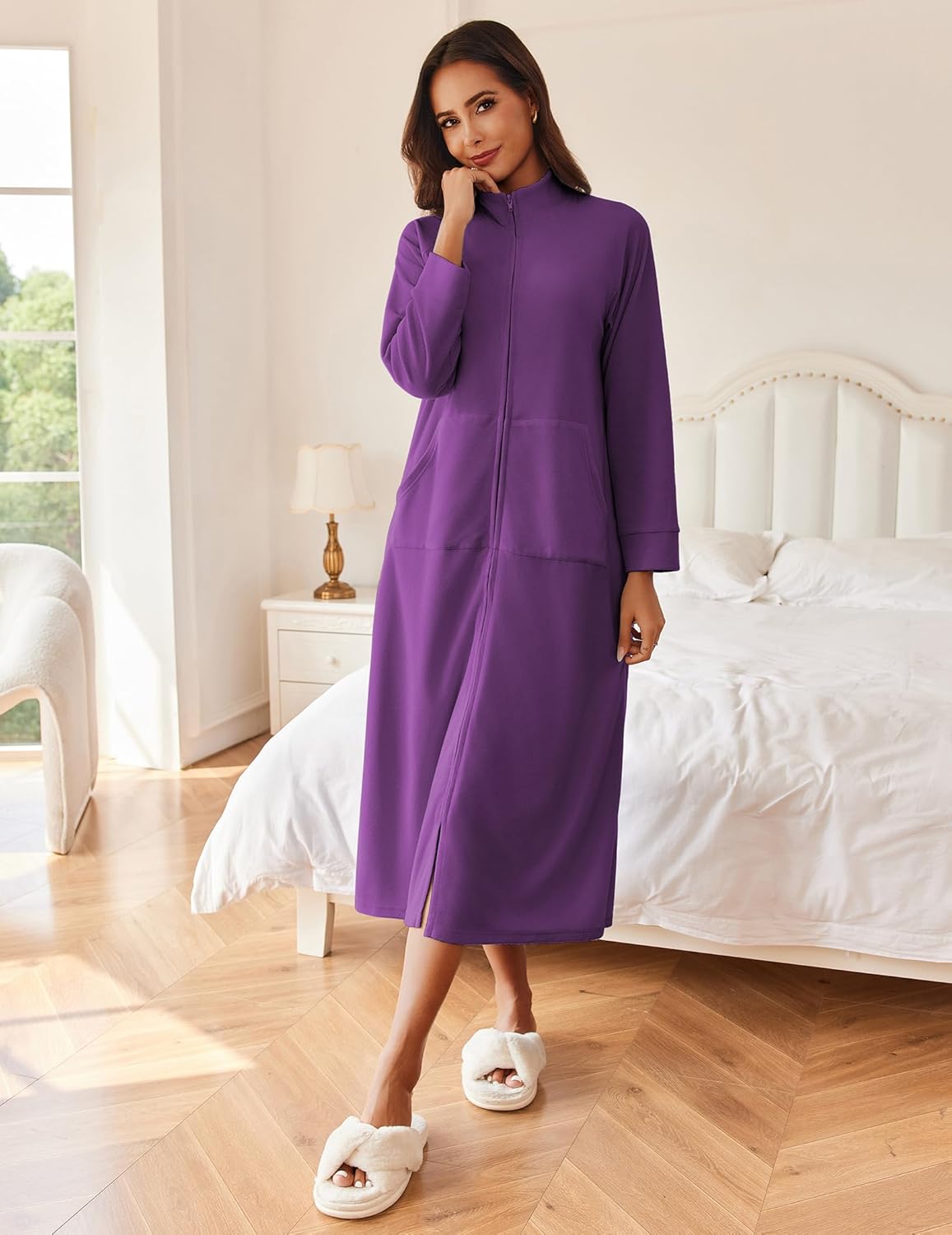 Purple long sleeve zip robe house coat with stand collar and side pockets.